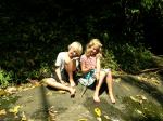 kids on rock near creek