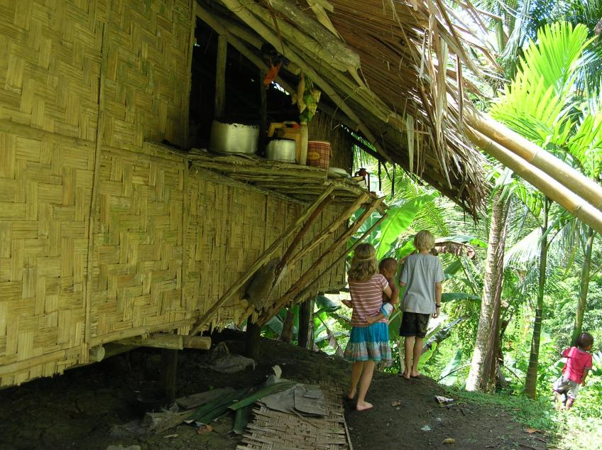 Andrew and Alyssa beside house